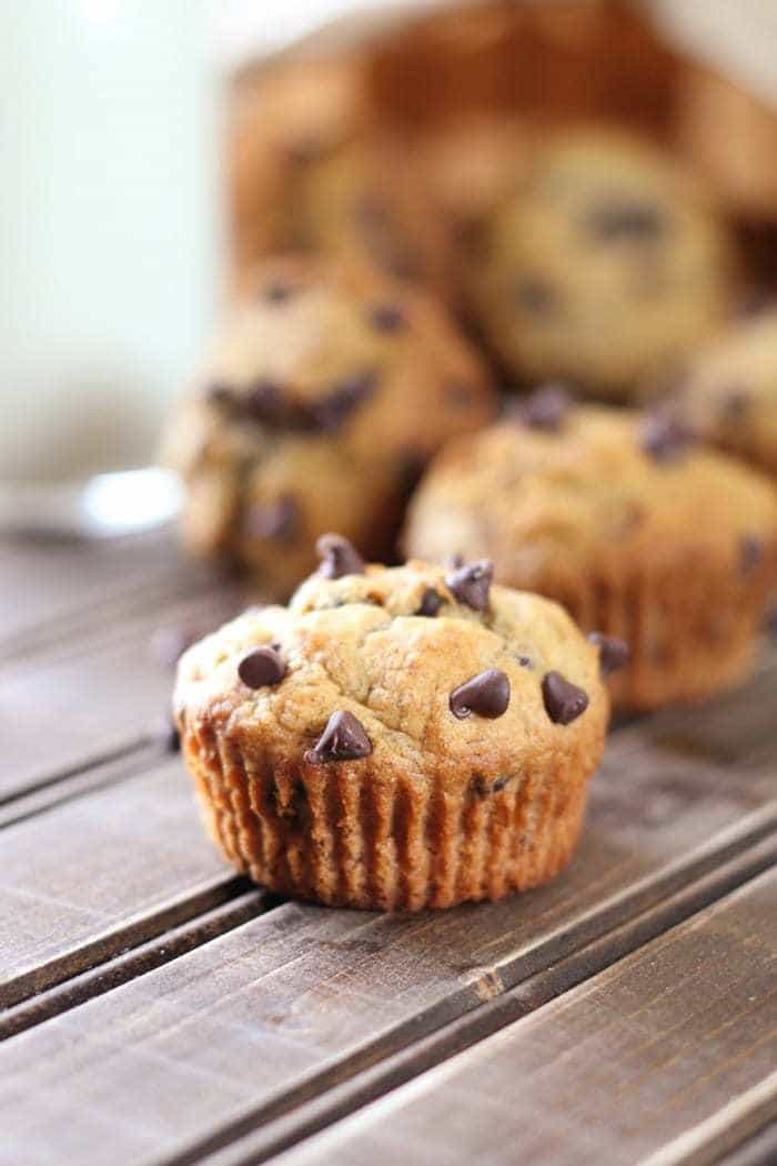Whole wheat banana muffins with chocolate chips make a healthy choice for snack time or breakfast! Make a bunch and pop them in the freezer.