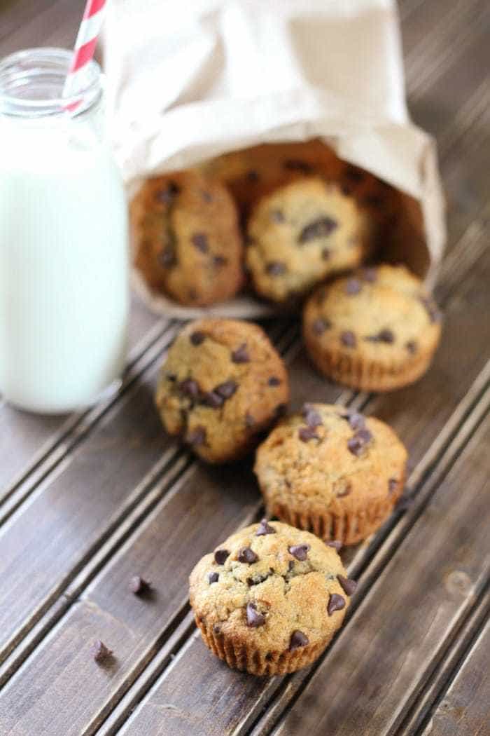 Whole wheat banana muffins with chocolate chips make a healthy choice for snack time or breakfast! Make a bunch and pop them in the freezer.