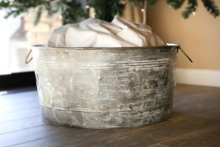 Add farmhouse charm with this DIY galvanized bucket to hold your Christmas tree.