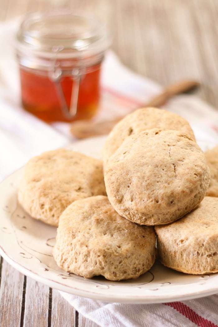 Homemade whole wheat cutout biscuits are super easy and taste delicious! This recipe has no refined sugar and takes only 30 minutes or so!