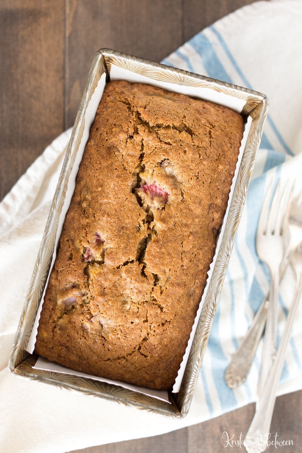 Fresh strawberry banana bread made with white whole wheat flour for a healthier bread! Lightly sweet and perfect for summertime!