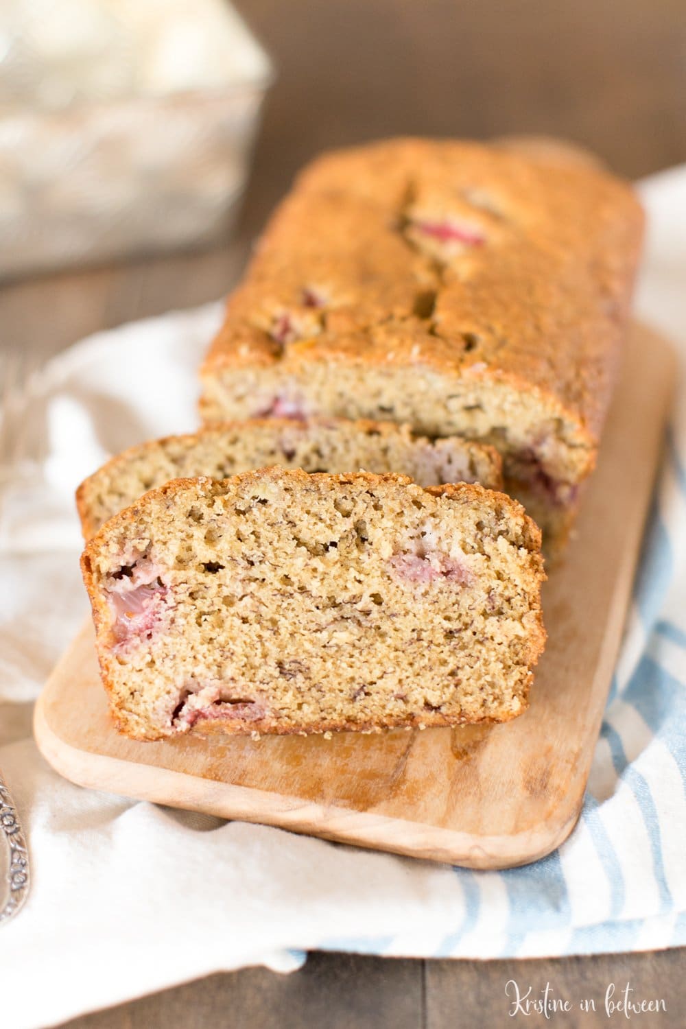 Fresh strawberry banana bread made with white whole wheat flour for a healthier bread! Lightly sweet and perfect for summertime!