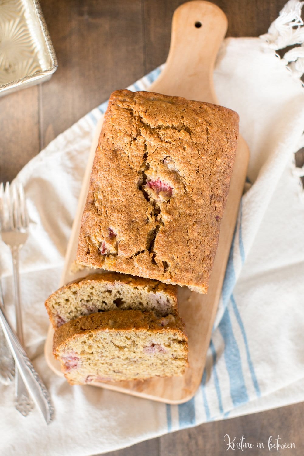 Fresh strawberry banana bread made with white whole wheat flour for a healthier bread! Lightly sweet and perfect for summertime!