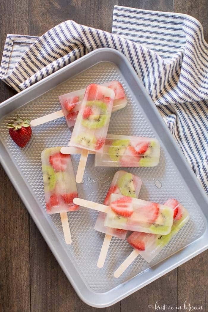 Easy homemade strawberry kiwi popsicles made without sugar! Just a few fresh ingredients and some coconut water is all you need!