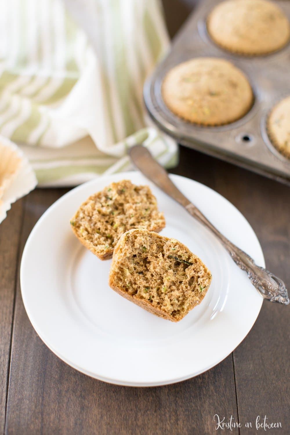 Homemade whole wheat zucchini muffins! Soft and fully of flavor, the perfect way to use up all of those summer zucchinis!