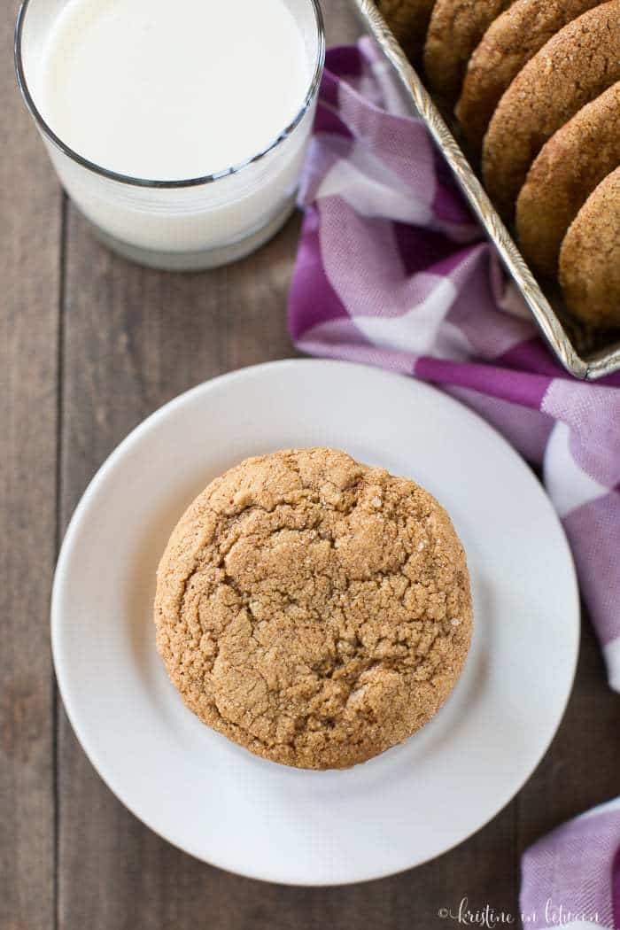 A stack of cookies on a white plate showing the cracked top details of the cookie.