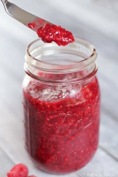 Homemade raspberry jam without refined sugar or pectin. Chia seeds are the magic thickening agent in this tasty jam!