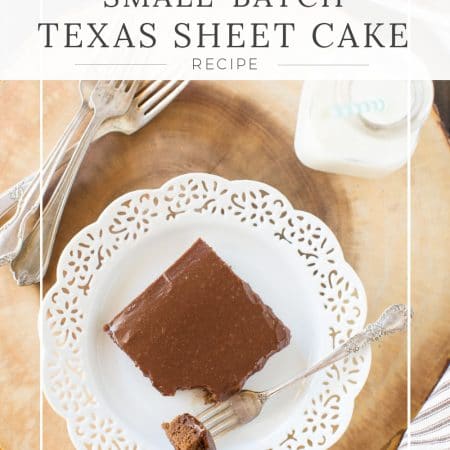 A piece of Texas sheet cake sitting on a white plate with a fork