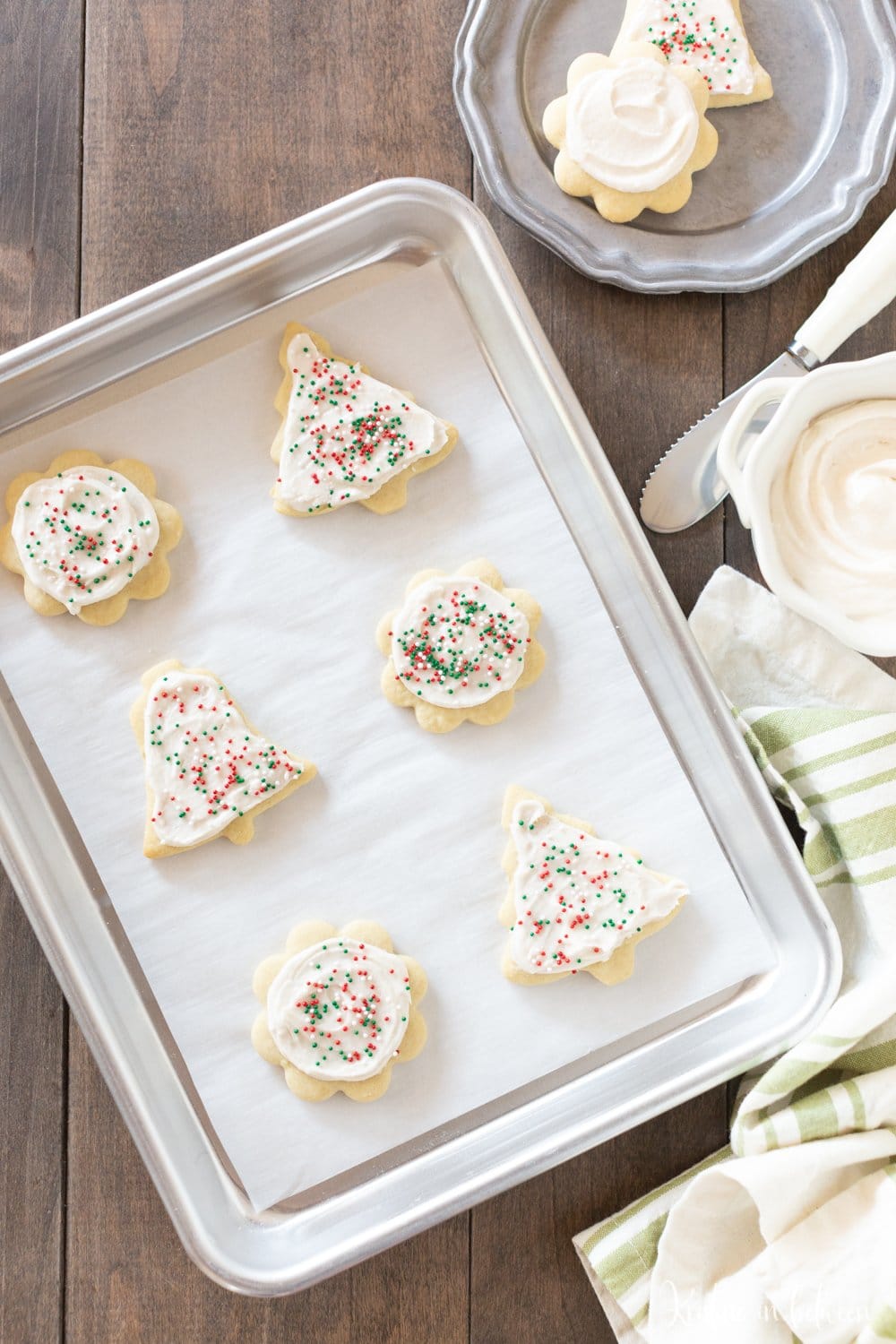 This is the best traditional sugar cookie recipe around! The cookies are light and flaky, perfect for topping with homemade buttercream frosting and sprinkles!