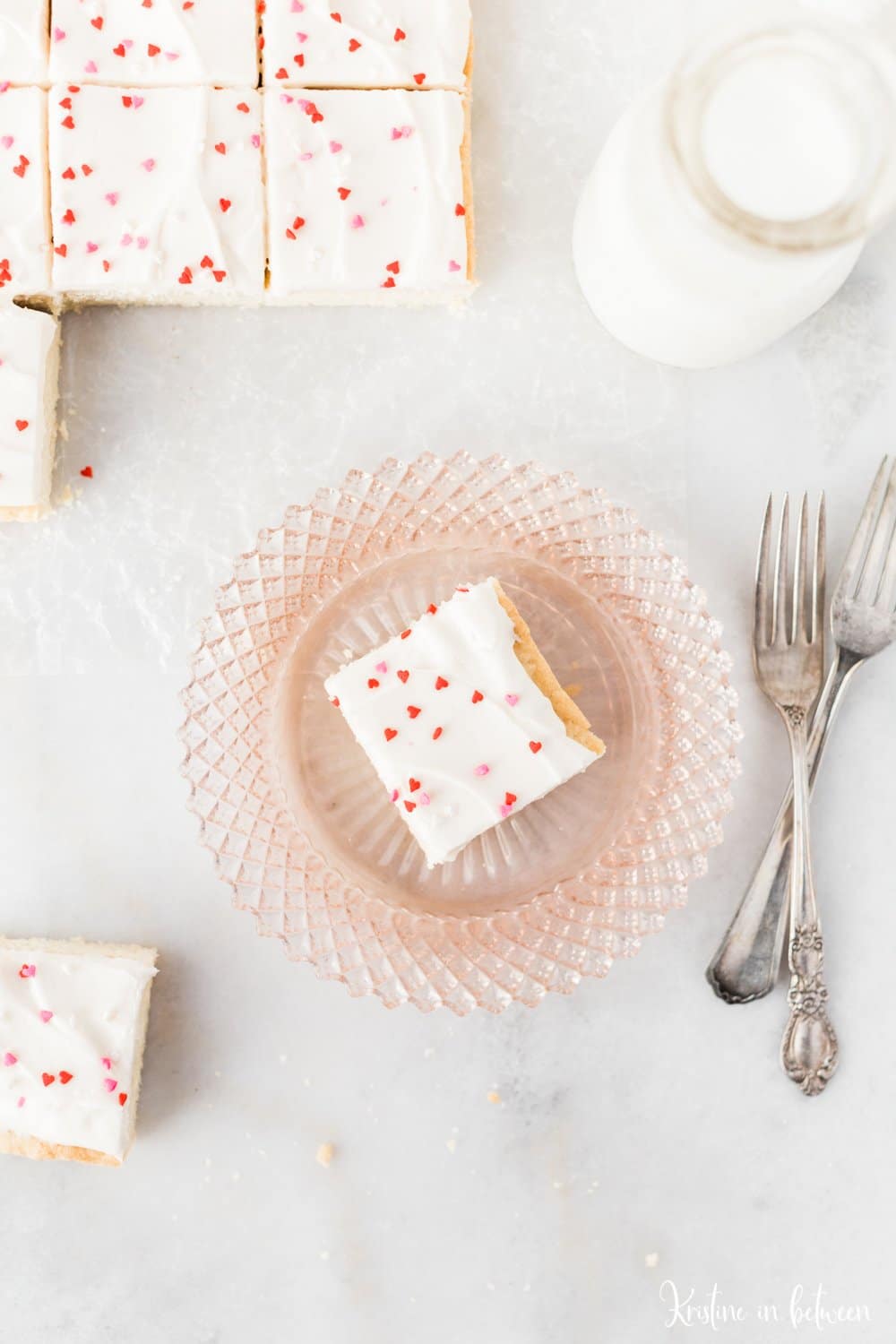 Super easy small batch sugar cookie bars with cream cheese frosting!