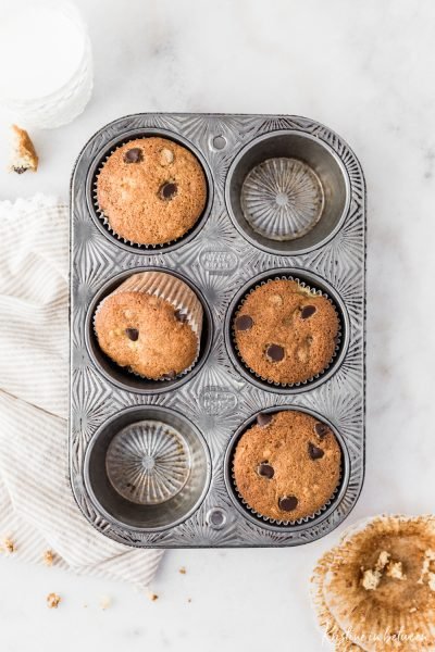 Super easy everyday chocolate chip banana bread muffins! They're light and fluffy and loaded with chocolate!