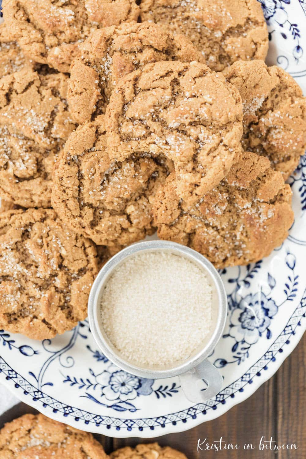 Cookies piled up on a blue and white platter.