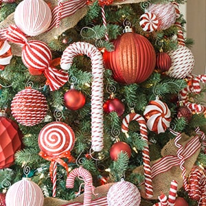 A Christmas tree decorated in red and white candy canes.
