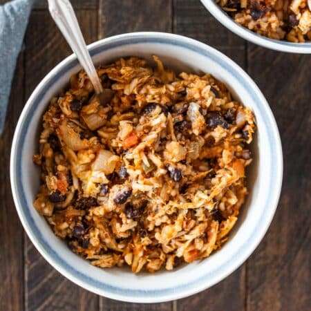 A bowl of taco chicken rice casserole with a fork in it.