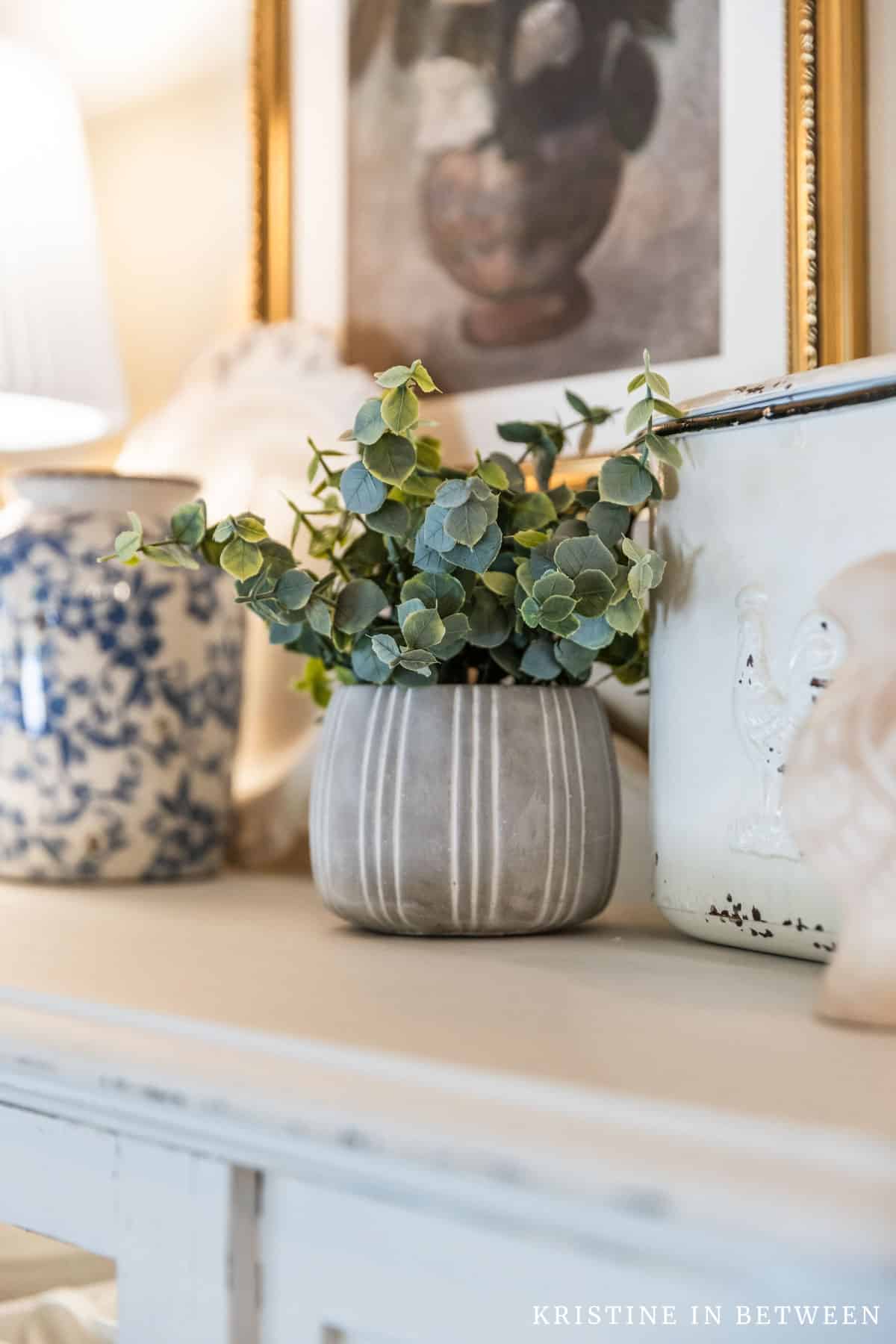 The top of a chia cabinet decorated in granny chic.