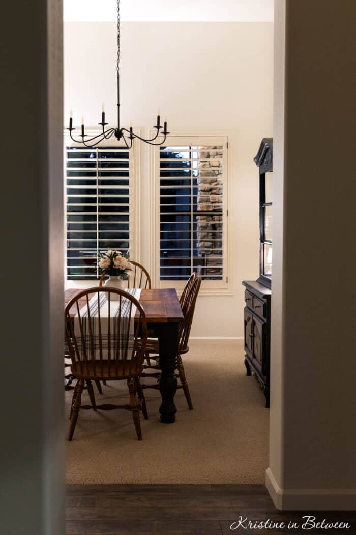 A farmhouse dining room at nighttime.