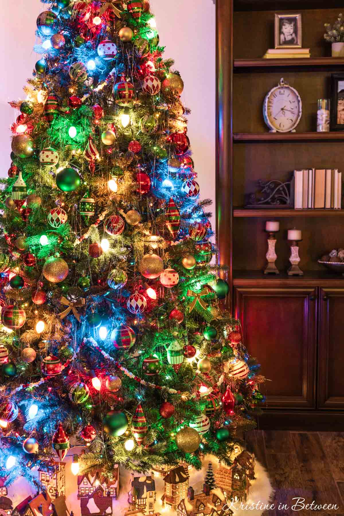 A traditionally decorated Christmas tree with multicolored lights.