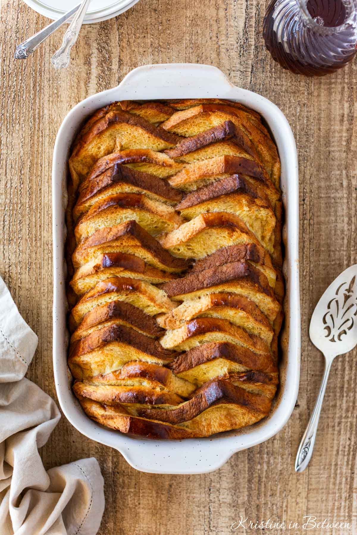A baked French toast casserole in a baking dish, just out of the oven.