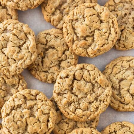Chewy peanut butter oatmeal cookies on a baking sheet.